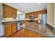 Well-appointed kitchen with granite countertops, stainless steel appliances, and custom cabinetry at 9020 Smokey Hill Ln, Fort Mill, SC 29707