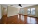 Inviting living room featuring hardwood floors, large windows, and a neutral color palette at 9020 Smokey Hill Ln, Fort Mill, SC 29707