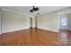 Bright and spacious living room with hardwood flooring, neutral walls, and ample natural light at 9020 Smokey Hill Ln, Fort Mill, SC 29707