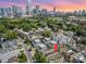 Stunning aerial view of townhomes near the vibrant Charlotte skyline and Bank of America Stadium at 925 Westbrook Dr # B, Charlotte, NC 28202