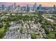 A high angle view showing the cityscape with modern buildings and a dense residential area with green trees at 925 Westbrook Dr # B, Charlotte, NC 28202