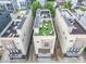 Aerial view shows townhomes with rooftop patios and outdoor furniture at 925 Westbrook Dr # B, Charlotte, NC 28202