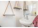 Bathroom with hanging rope shelves, white vessel sink, and simple faucet at 925 Westbrook Dr # B, Charlotte, NC 28202