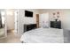 Bedroom with a black dresser, TV and direct access to a bathroom and staircase at 925 Westbrook Dr # B, Charlotte, NC 28202
