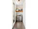 Hallway with a mini-refrigerator and shelving for storage at 925 Westbrook Dr # B, Charlotte, NC 28202