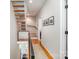 Hallway with wood staircase and modern railing at 925 Westbrook Dr # B, Charlotte, NC 28202
