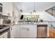 Modern kitchen island featuring stainless steel appliances, quartz countertops, and stylish pendant lighting at 925 Westbrook Dr # B, Charlotte, NC 28202