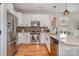 Updated kitchen showcasing white cabinets, stainless steel appliances, and a center island with sink and barstools at 925 Westbrook Dr # B, Charlotte, NC 28202