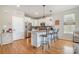 Modern kitchen featuring white cabinets, a center island with bar stool seating and stainless steel appliances at 925 Westbrook Dr # B, Charlotte, NC 28202