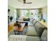 Bright living room with hardwood floors, large windows, and a comfortable sectional sofa at 925 Westbrook Dr # B, Charlotte, NC 28202