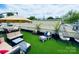 Relaxing rooftop terrace with artificial grass, lounge furniture, and cityscape views at 925 Westbrook Dr # B, Charlotte, NC 28202