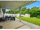View of the backyard featuring a covered patio with seating area and privacy fence at 9733 Paper Tree Rd, Charlotte, NC 28227