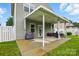 Backyard featuring a covered patio with seating area and grill with an outdoor grill at 9733 Paper Tree Rd, Charlotte, NC 28227