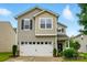 Charming two-story home featuring a two-car garage, well-maintained lawn, and lovely landscaping at 9733 Paper Tree Rd, Charlotte, NC 28227