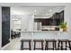 Kitchen featuring granite countertops, stainless steel appliances, a kitchen island, and dark wood cabinets at 9733 Paper Tree Rd, Charlotte, NC 28227