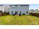 A well maintained back yard with a patio, BBQ grill, and outdoor seating at 1022 Hinson Forest Rd, Monroe, NC 28110