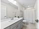 Bathroom with modern fixtures, large mirror, shower with curtain, and tiled floor at 1022 Hinson Forest Rd, Monroe, NC 28110