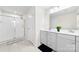 Bathroom featuring double vanity, tile flooring, a large mirror, and glass shower stall at 1022 Hinson Forest Rd, Monroe, NC 28110