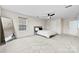 Spacious bedroom with carpeted flooring, a modern ceiling fan, and a large mirror at 1022 Hinson Forest Rd, Monroe, NC 28110
