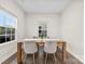 Dining room with wood floors, bright windows, and modern furniture at 1022 Hinson Forest Rd, Monroe, NC 28110