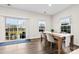 Dining room with wood floors, bright windows, and modern furniture at 1022 Hinson Forest Rd, Monroe, NC 28110