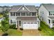 Charming two-story home features a manicured lawn and a two-car garage at 1022 Hinson Forest Rd, Monroe, NC 28110