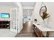 Inviting hallway with dark wood floors and views to the living room at 1022 Hinson Forest Rd, Monroe, NC 28110