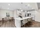 Bright kitchen featuring an island with bar seating, and modern appliances at 1022 Hinson Forest Rd, Monroe, NC 28110