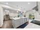 Bright, open kitchen featuring a large island with stainless steel appliances and sliding doors to the backyard at 1022 Hinson Forest Rd, Monroe, NC 28110