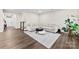 Spacious living room with a plush sofa, modern rug, and hardwood floors at 1022 Hinson Forest Rd, Monroe, NC 28110