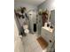 Updated bathroom with glass-enclosed shower, gray walls, white vanity, and unique decorative accents at 110 Buffalo Nw Ave, Concord, NC 28025