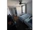 Cozy bedroom features a blue bedspread, natural light, and ample closet space for comfortable living at 110 Buffalo Nw Ave, Concord, NC 28025