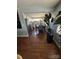 Eat-in kitchen with stainless steel appliances, white cabinets, subway tile backsplash, and a modern dining set at 110 Buffalo Nw Ave, Concord, NC 28025