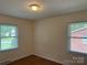 Bedroom with hardwood floors, window, and neutral paint provides a cozy atmosphere at 1115 Dumbarton Rd, Gastonia, NC 28054