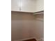 Unfinished reach-in closet with a rod for hanging clothes for functional storage solutions at 1115 Dumbarton Rd, Gastonia, NC 28054