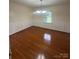 Formal dining room with hardwood floors, wainscoting, and ample natural light at 1115 Dumbarton Rd, Gastonia, NC 28054