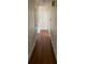 Hallway features hardwood floors, white trim and moulding, and classic doors and hardware at 1115 Dumbarton Rd, Gastonia, NC 28054