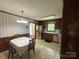 Eat-in kitchen with an adjacent dining space, stainless steel refrigerator, and traditional accents at 1115 Dumbarton Rd, Gastonia, NC 28054