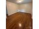 Living room featuring hardwood floors and natural light, offering an inviting and comfortable space at 1115 Dumbarton Rd, Gastonia, NC 28054