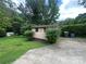 Exterior photo of a storage shed on a grassy lot with driveway access at 1115 Dumbarton Rd, Gastonia, NC 28054