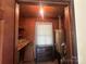 Utility room with water heater, shelving, window, and storage for practical home maintenance at 1115 Dumbarton Rd, Gastonia, NC 28054