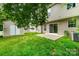 Backyard features a well-maintained lawn, shed and sliding glass door at 116 Amber Woods Dr, Tega Cay, SC 29708