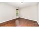 Bedroom features hardwood floors and a window allowing for lots of natural light at 116 Amber Woods Dr, Tega Cay, SC 29708