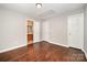 Bedroom with hardwood floors, and access to a bathroom at 116 Amber Woods Dr, Tega Cay, SC 29708