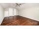 Bedroom features hardwood floors, a ceiling fan, and two closets at 116 Amber Woods Dr, Tega Cay, SC 29708