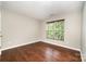 Bedroom with hardwood floors and a window allowing for lots of natural light at 116 Amber Woods Dr, Tega Cay, SC 29708