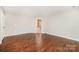 Bright bedroom with hardwood floors and two windows offering natural light at 116 Amber Woods Dr, Tega Cay, SC 29708