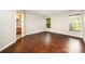 Spacious bedroom features hardwood floors, natural light, and an ensuite bathroom at 116 Amber Woods Dr, Tega Cay, SC 29708
