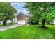 Charming two-story brick home with a well-manicured lawn and attached two-car garage at 116 Amber Woods Dr, Tega Cay, SC 29708