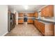 Spacious kitchen with wooden cabinets and stainless steel appliances and plenty of countertop space at 116 Amber Woods Dr, Tega Cay, SC 29708